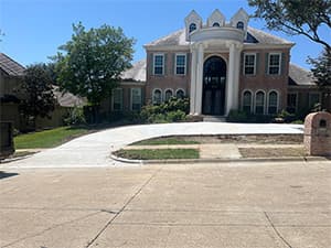 Front view of a modern two-story home with freshly installed James Hardie™ HardiePlank® siding in Arctic White, featuring clean trim and new windows.