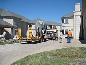 Front view of a modern two-story home with freshly installed James Hardie™ HardiePlank® siding in Arctic White, featuring clean trim and new windows.
